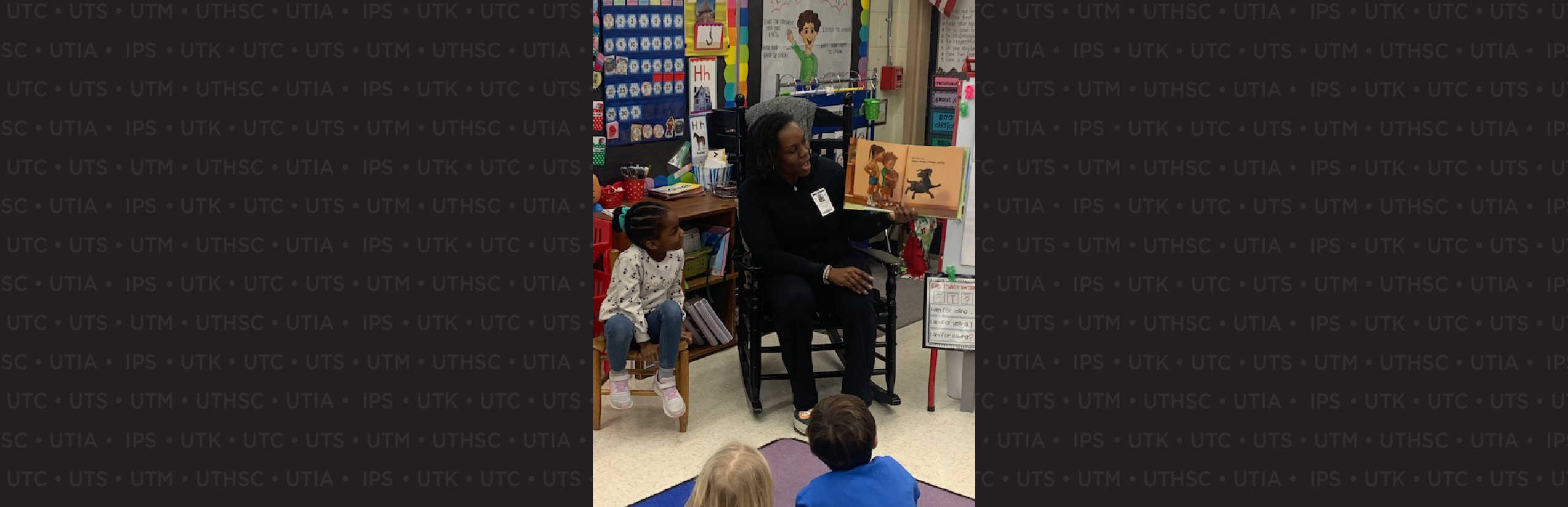 Dr. Shalaunda Reeves reading to classroom of children.